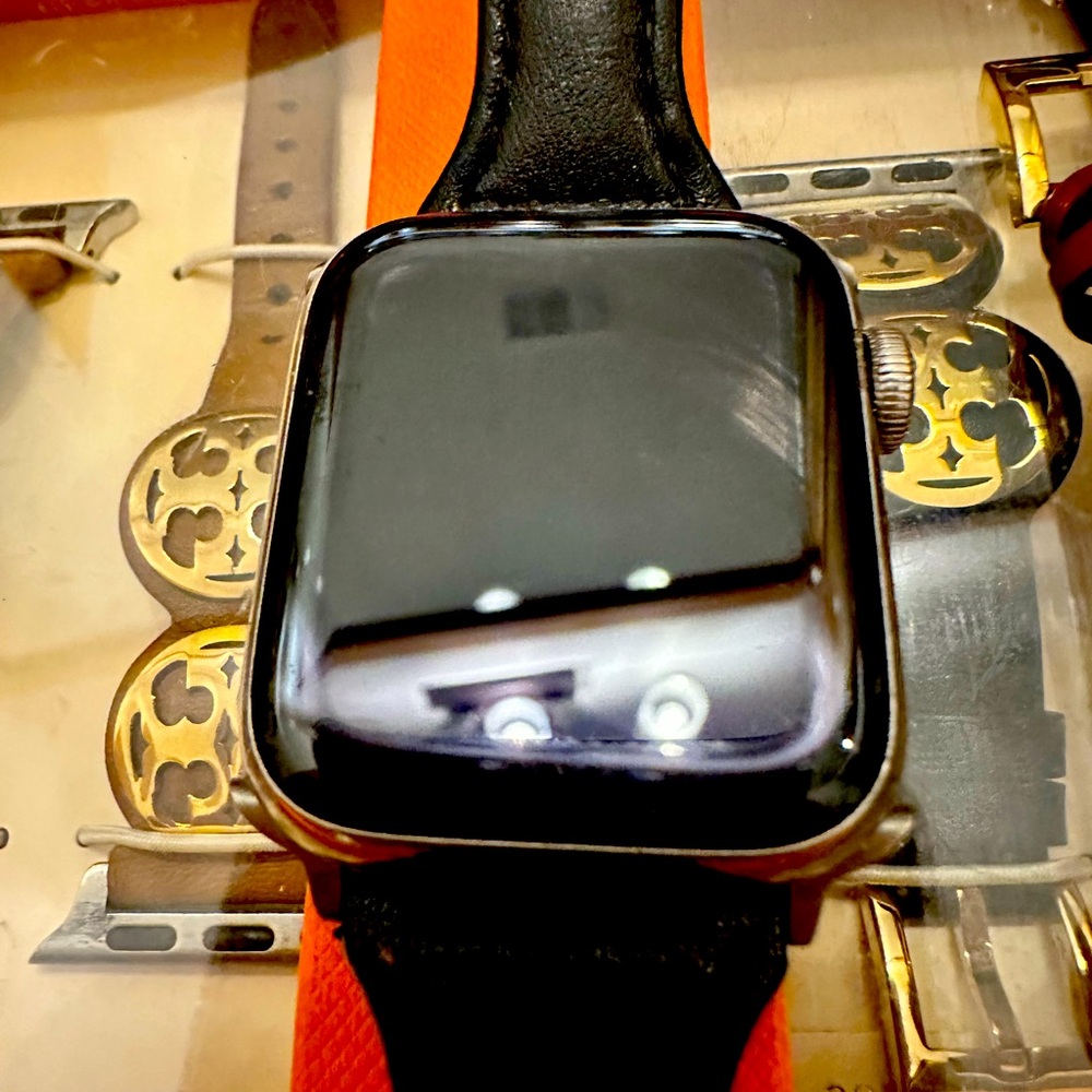Bundle of an Apple Watch 6 in box, with 3 Tory Burch watch bands.